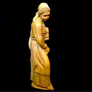 Vintage carved wood statue of woman harvesting wheat. 10 inches tall.